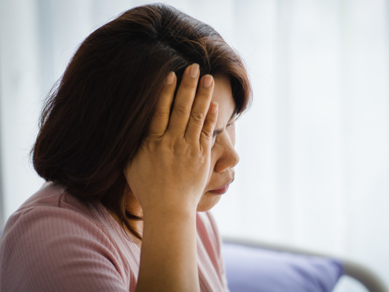 woman holding her head